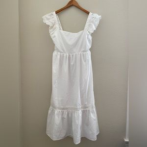 Vici White mid length dress with cute cut out in the back. Size large.